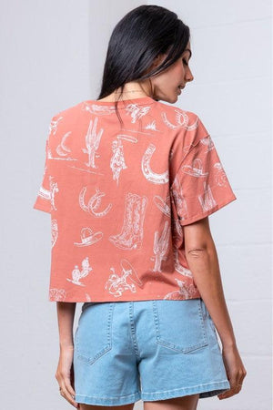 Woman wearing a patterned rust shirt