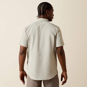 Light-colored, short-sleeve shirt.