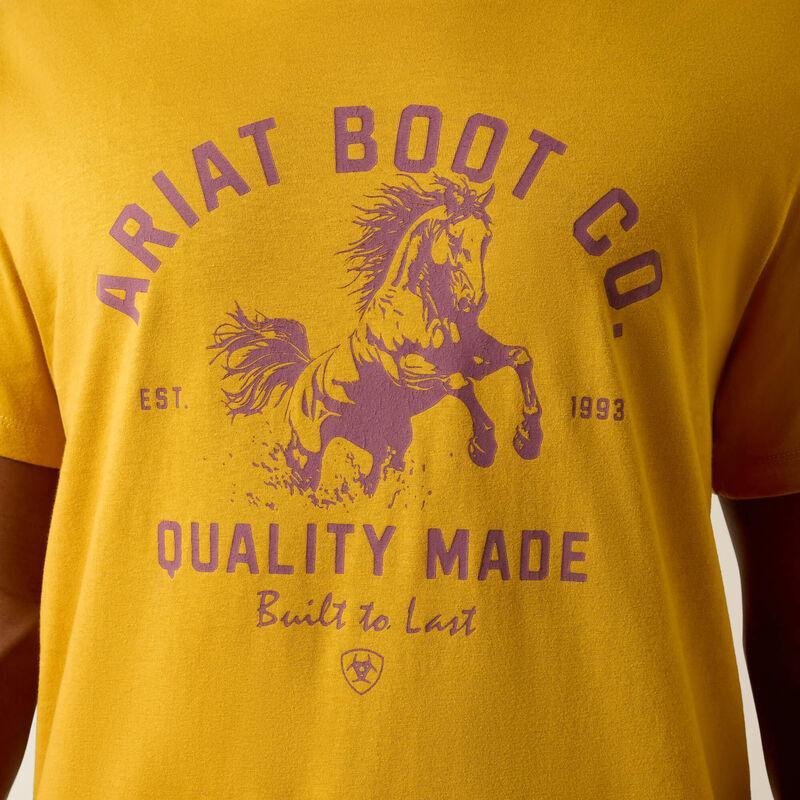 Yellow t-shirt with purple 'Ariat Boot Co.' logo and text on a yellow background