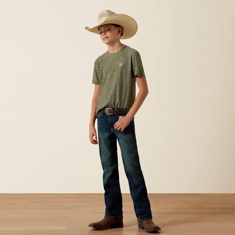 Child wearing a green t-shirt, blue jeans, and a cowboy hat on a plain background