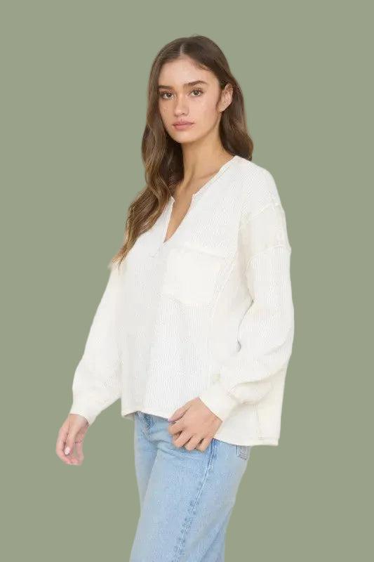 Woman wearing a Ivory sweater