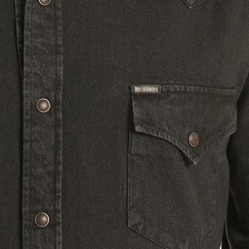 A man wearing a black western long-sleeve snap-down shirt 