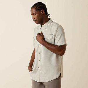 Light-colored, short-sleeve shirt.