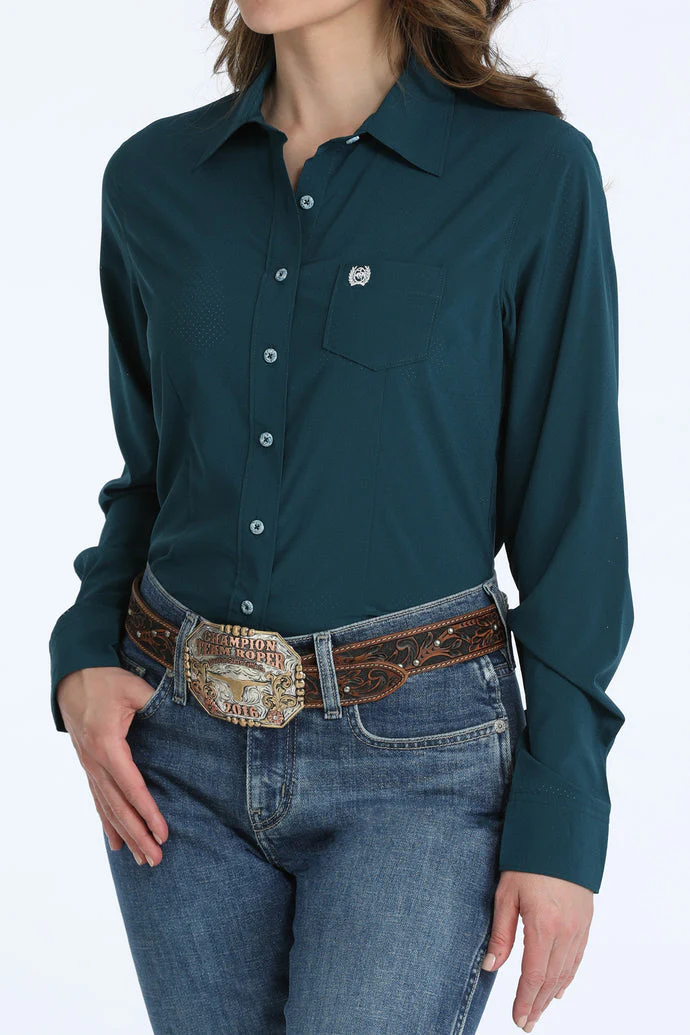 Teal button-up shirt worn by a person with a white background