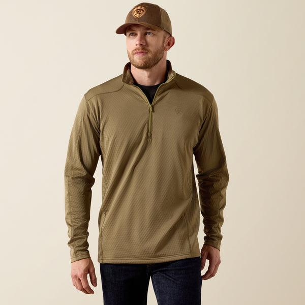 Man wearing a dusky green quarter-zip pullover