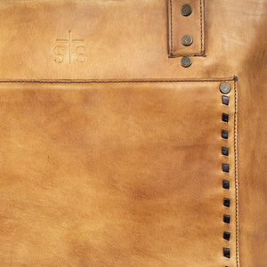 Close-up of a brown leather bag with stitching details and a brand logo.