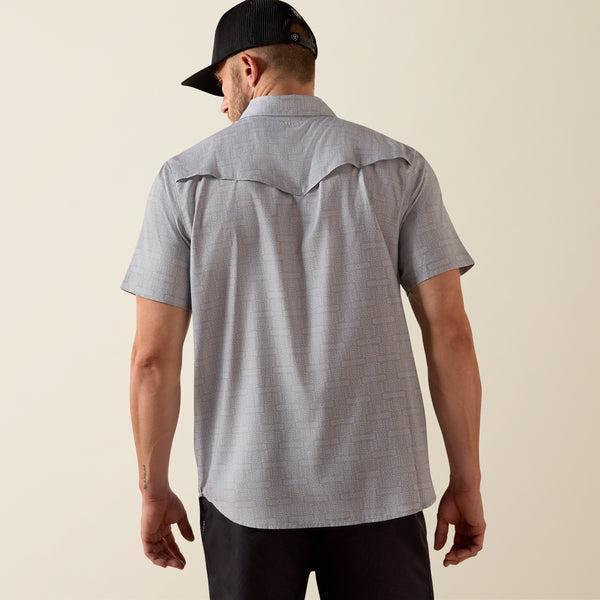 Man wearing grey patterned shirt
