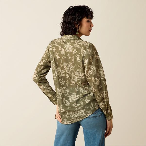 Woman wearing a green patterned shirt and blue jeans on a beige background