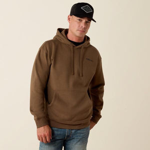 A man wearing a brown pullover hoodie with a drawstring hood and kangaroo pocket. 