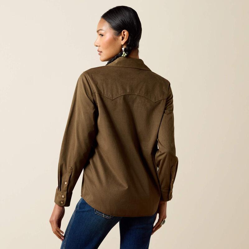 A woman modeling aolive green long-sleeve button-up shirt with two chest pockets. 