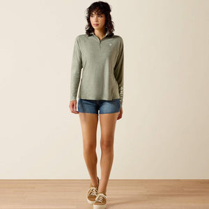 A green, long-sleeved shirt featuring the brand logo.