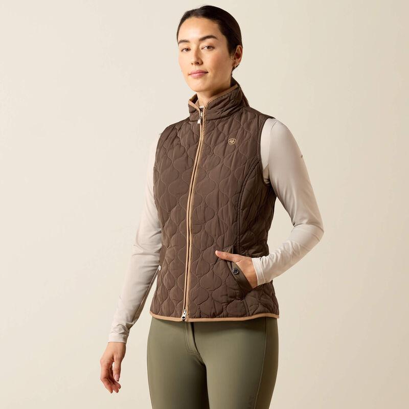 A woman modeling a brown quilted zip-front vest 