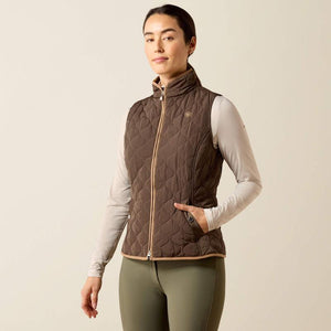 A woman modeling a brown quilted zip-front vest 