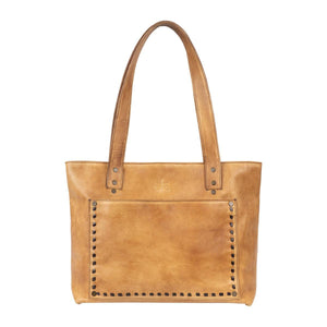 Brown leather tote bag with studded details on a white background