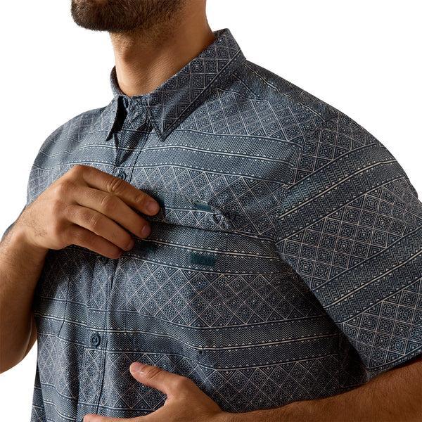Man wearing a Navy patterned short-sleeve shirt 