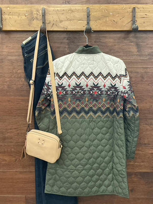 An olive green quilted jacket with a colorful geometric pattern across the chest and upper sleeves  