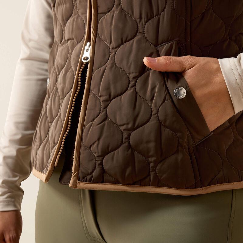 A woman modeling a brown quilted zip-front vest 