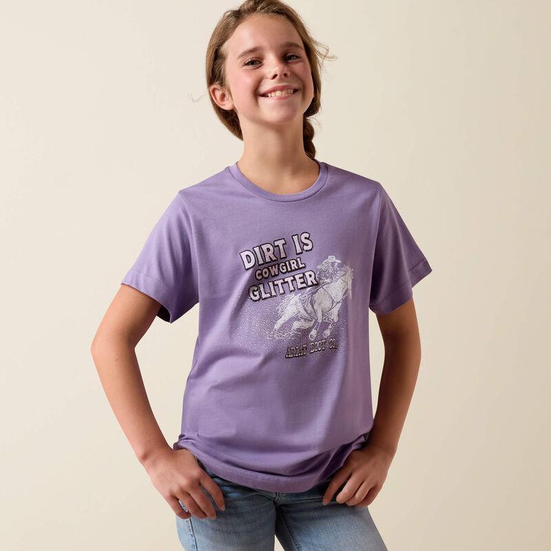Young girl wearing a purple t-shirt with 'Dirt is Cowgirl Glitter' text and graphic on a beige background