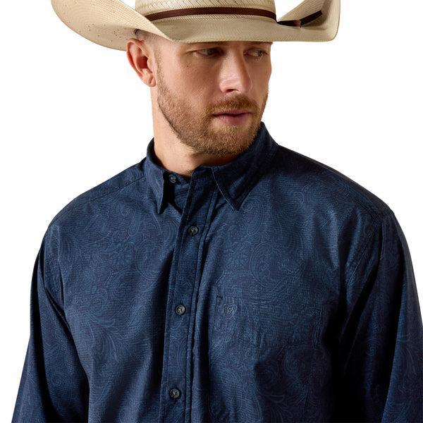 Man wearing a blue patterned shirt 