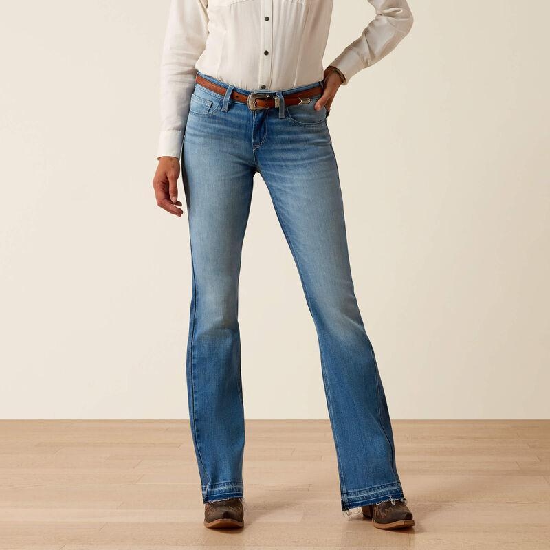 Person wearing a white shirt and blue jeans 