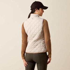 A woman modeling a quilted sleeveless vest 