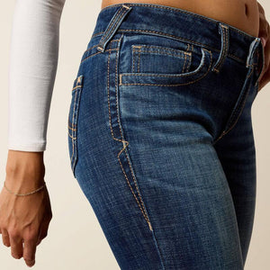 Close-up of blue jeans on a plain background