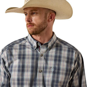 Man wearing a blue plaid shirt. 