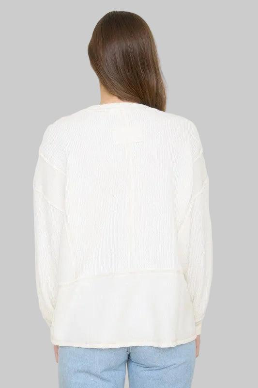 Woman wearing a Ivory sweater