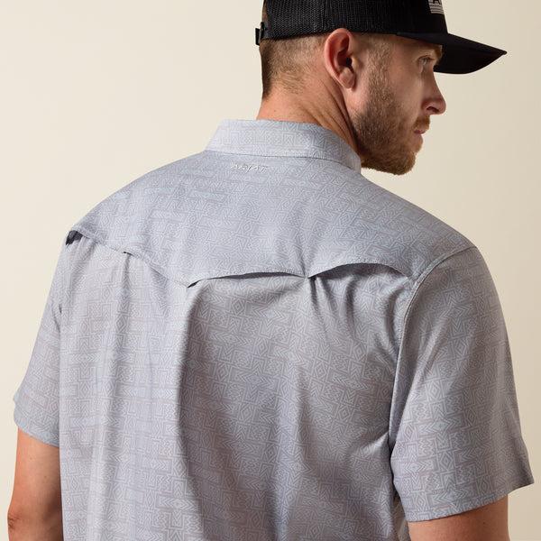 Man wearing grey patterned shirt