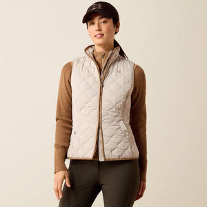 A woman modeling a quilted sleeveless vest 