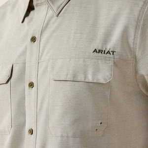 Light-colored, short-sleeve shirt.