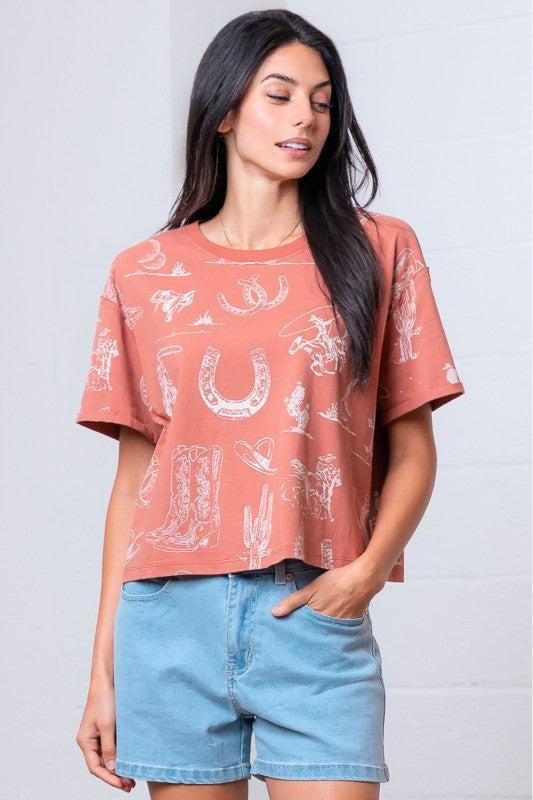 Woman wearing a patterned rust shirt