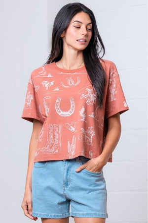 Woman wearing a patterned rust shirt