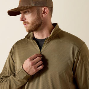 Man wearing a dusky green quarter-zip pullover