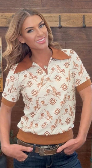 Woman wearing a patterned shirt with a blurred background