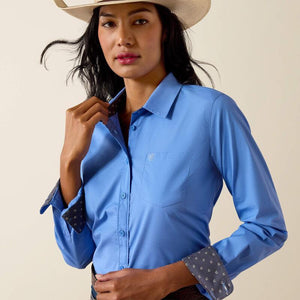 Long sleeve blue button up shirt.