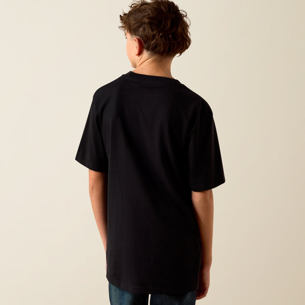 Person wearing a black t-shirt against a beige background