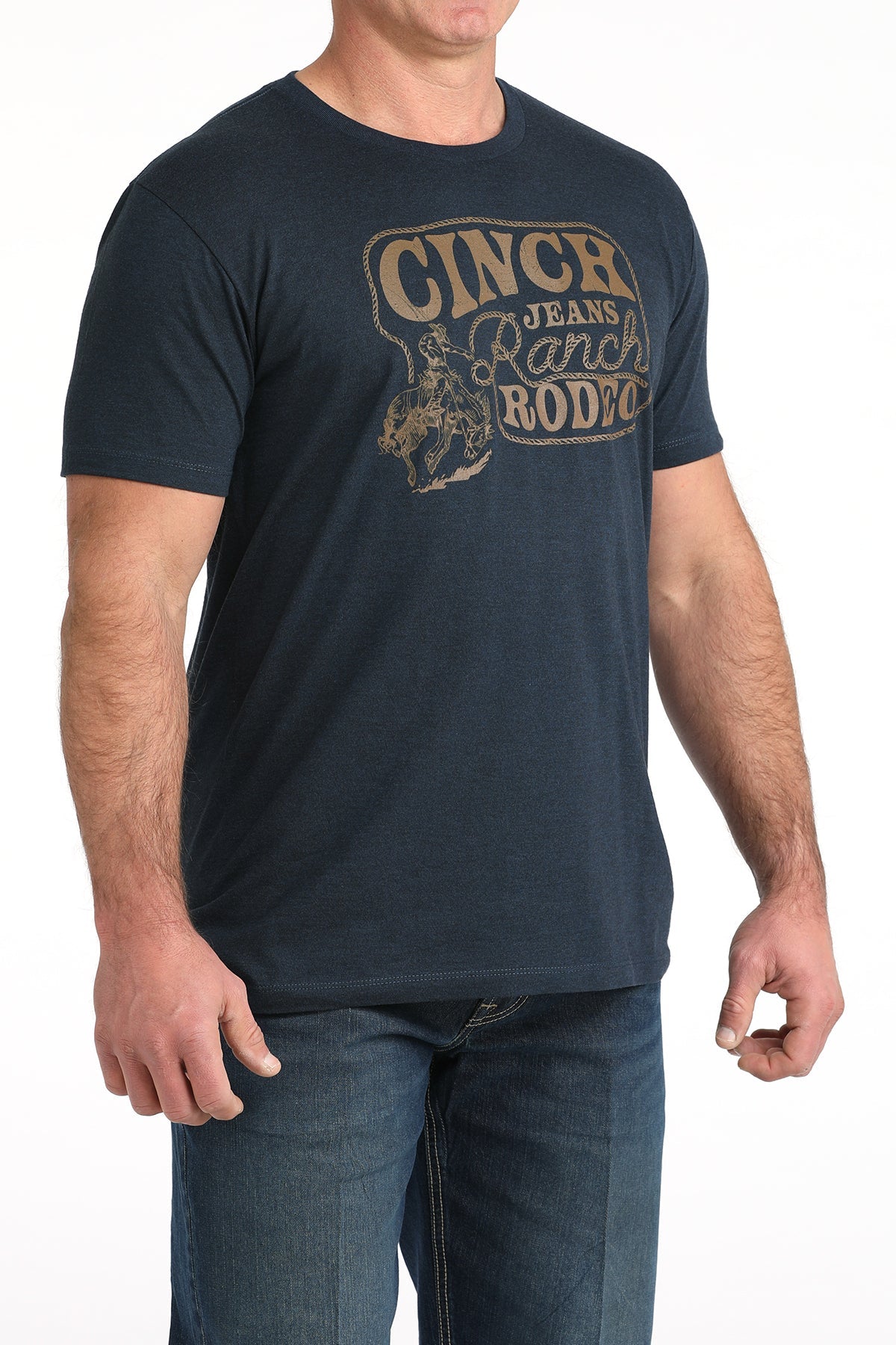 Man wearing a navy blue t-shirt with 'Cinch Jeans Ranch Rodeo
' graphic on a white background
