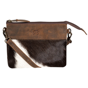 Brown leather crossbody bag with cowhide pattern on a white background
