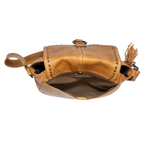 Brown leather bag with tassels on a white background