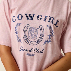 Pink t-shirt with 'Cowgirl Social Club' design featuring a horseshoe and cocktail graphic.
