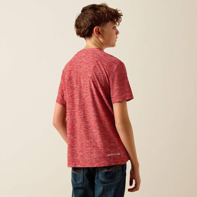 Person wearing a red t-shirt and blue jeans on a beige background