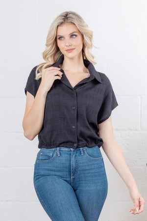 Woman wearing a black short-sleeve shirt